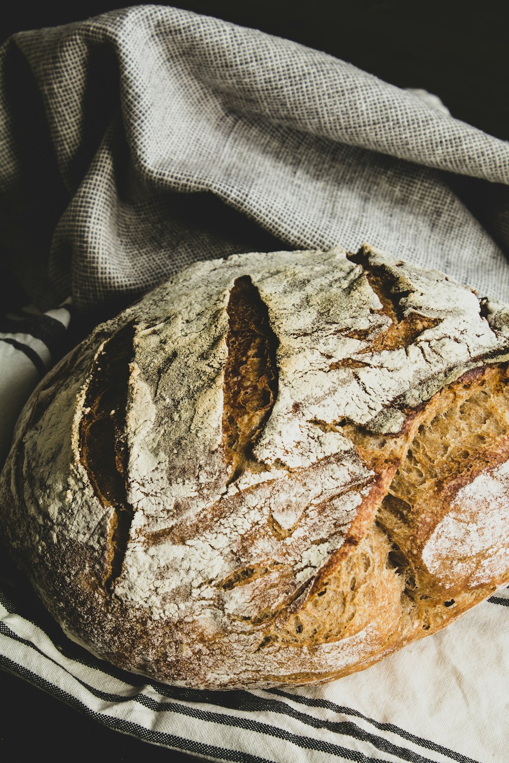 brown bread on white and black textile