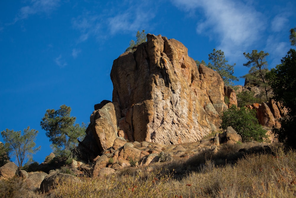 brown rock formation under blue sky during daytime