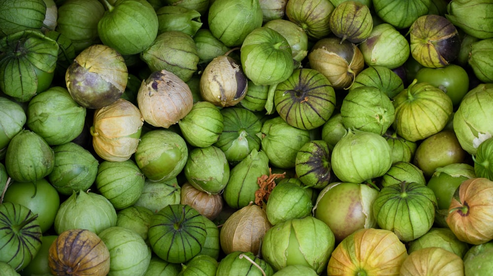 green and brown round fruits