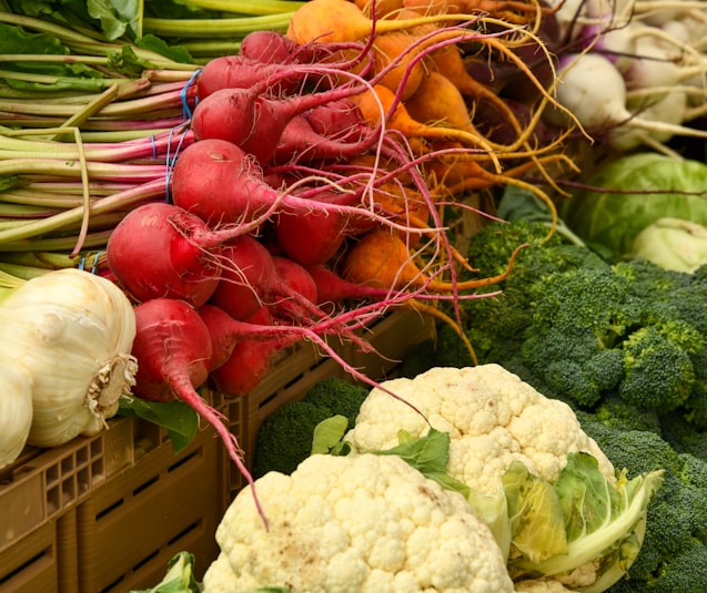 red and green vegetable on brown woven basket