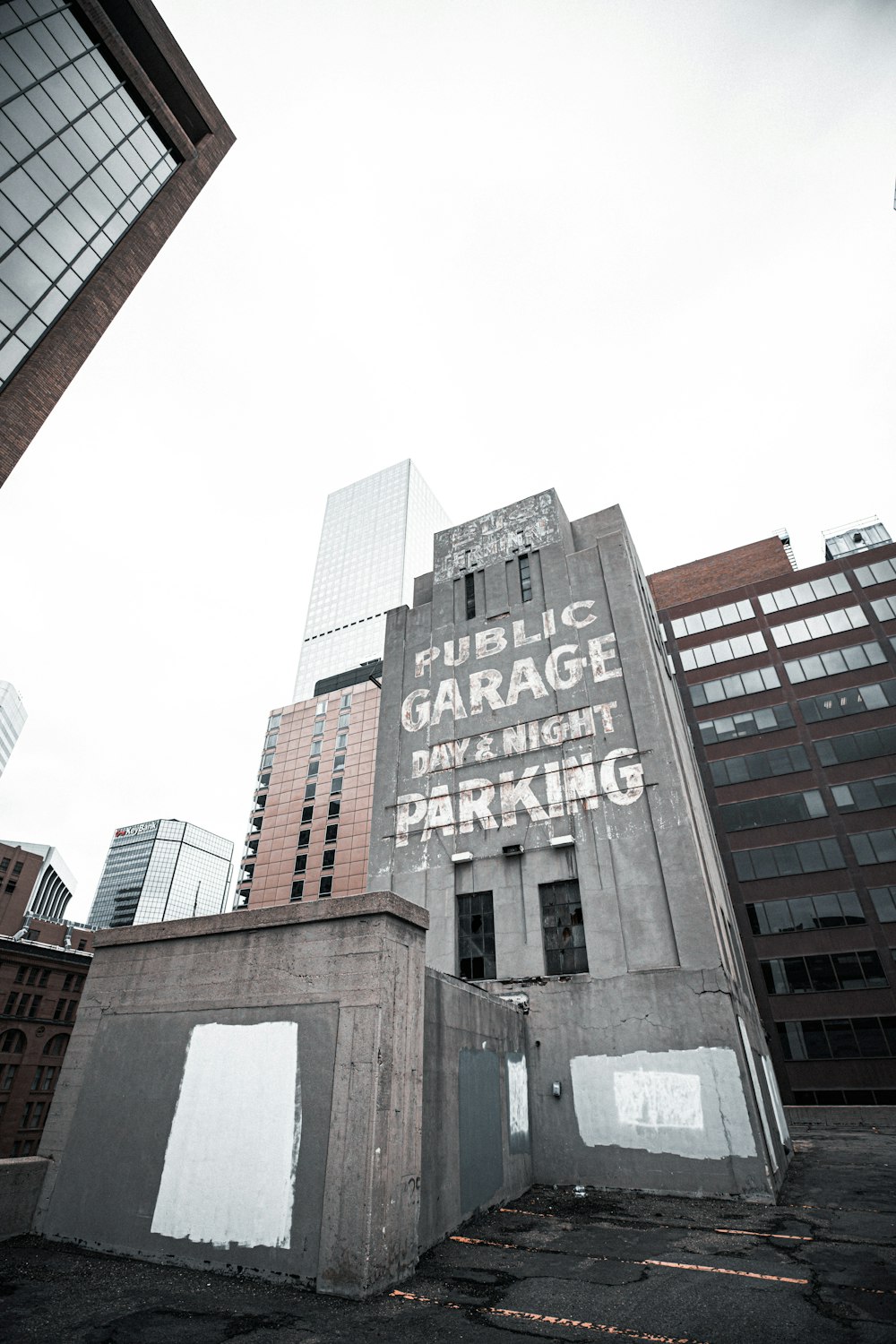 low angle photography of brown concrete building under white sky during daytime