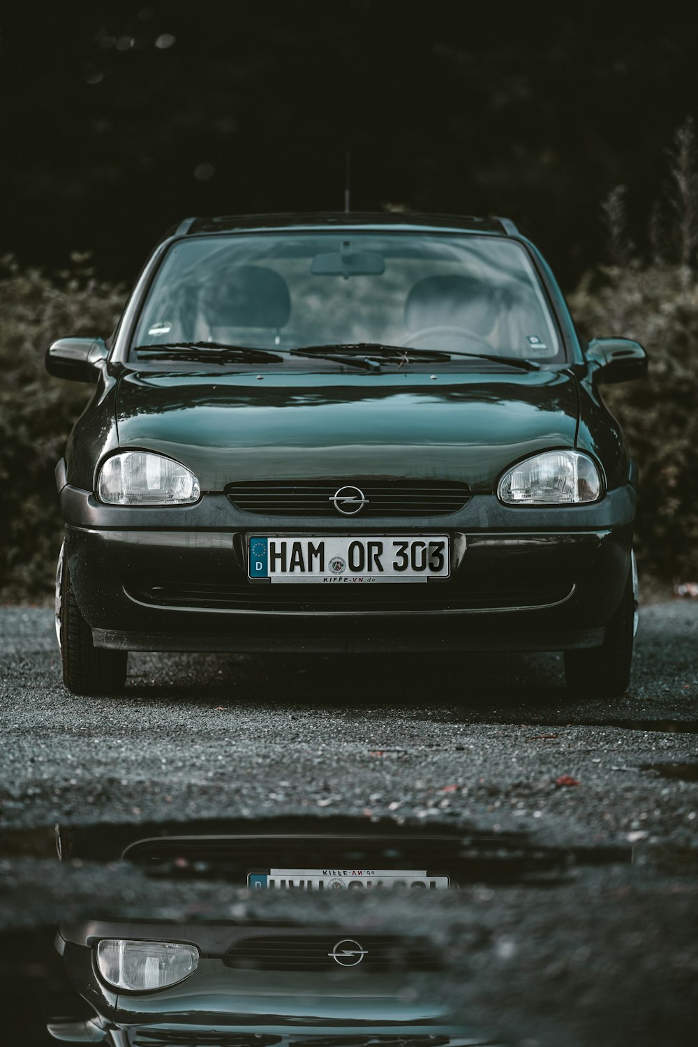 grayscale photography of car on road