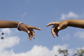 A comforting hand reaching out across a gap symbolizing support bridging a mental health waitlist.