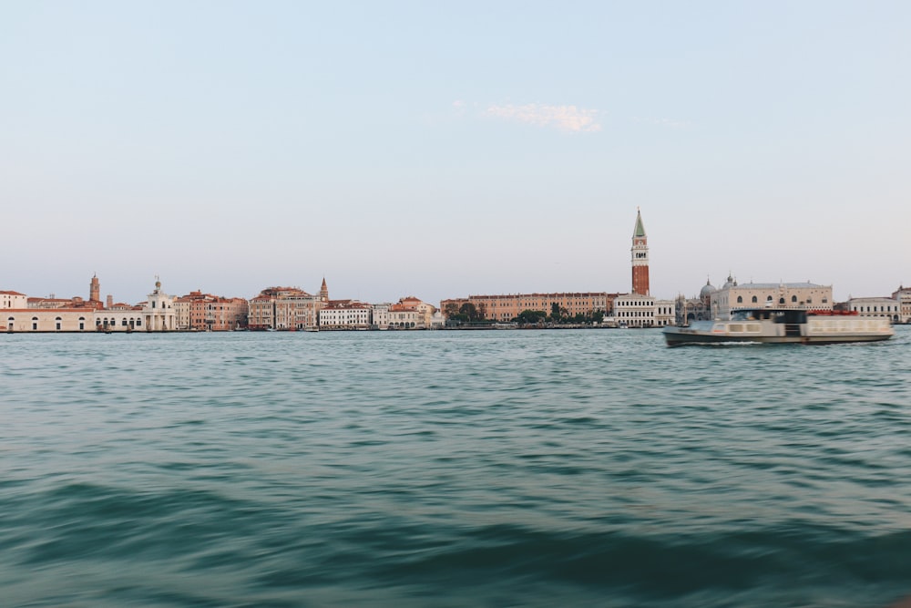 body of water near city buildings during daytime