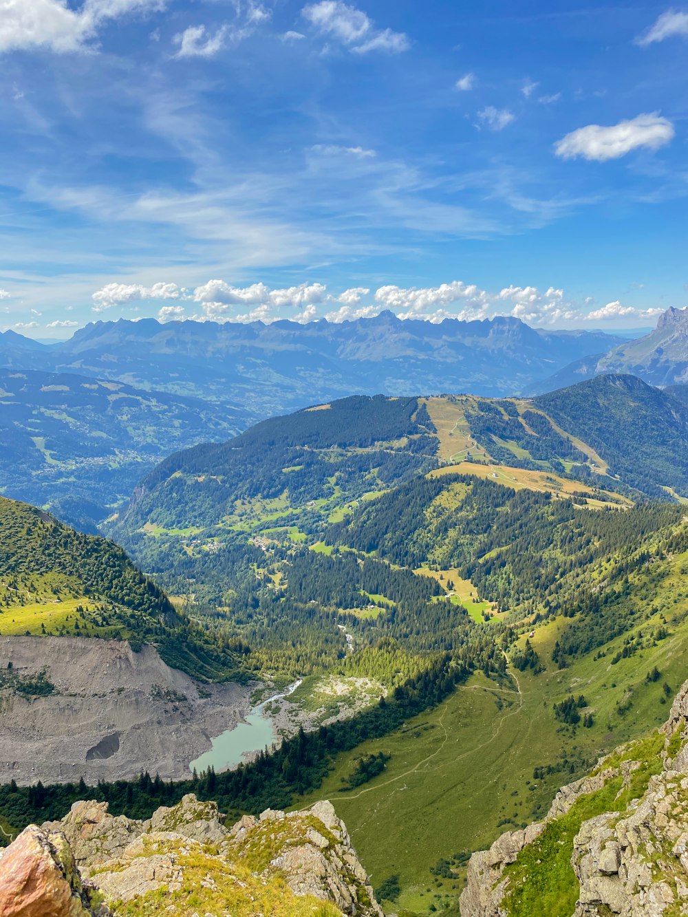 green mountains under white clouds during daytime