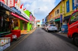 Colorful storefronts in Tulkarem bustling with activity and student engagement