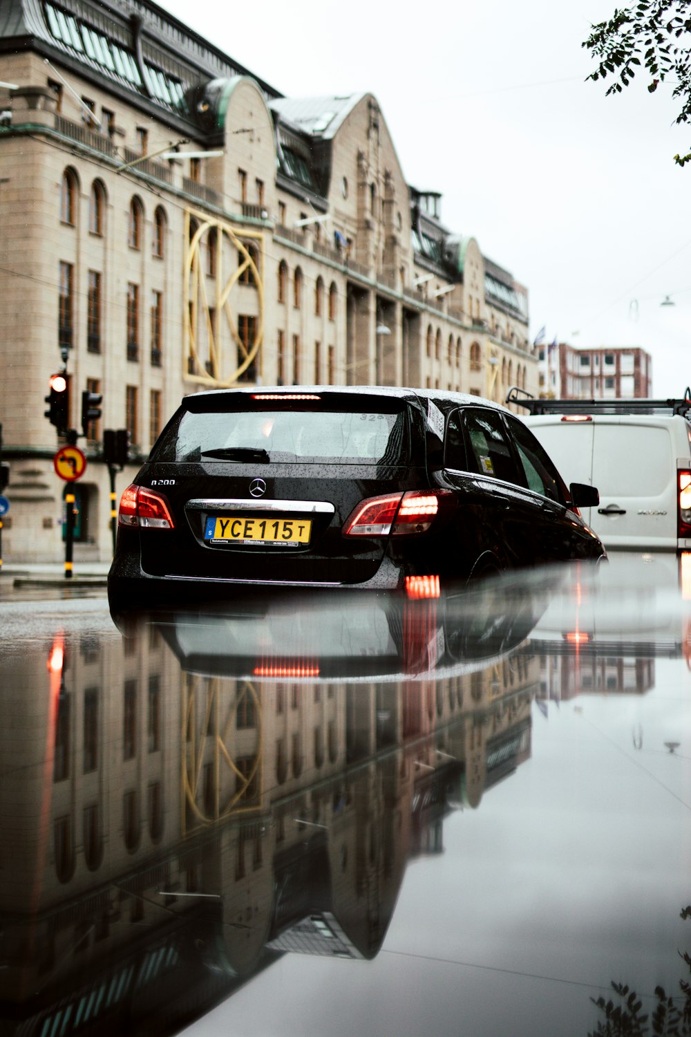 black sedan on road during daytime