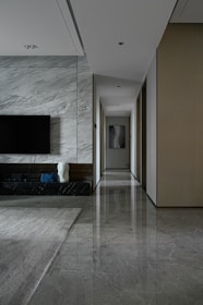 black flat screen tv on white wall