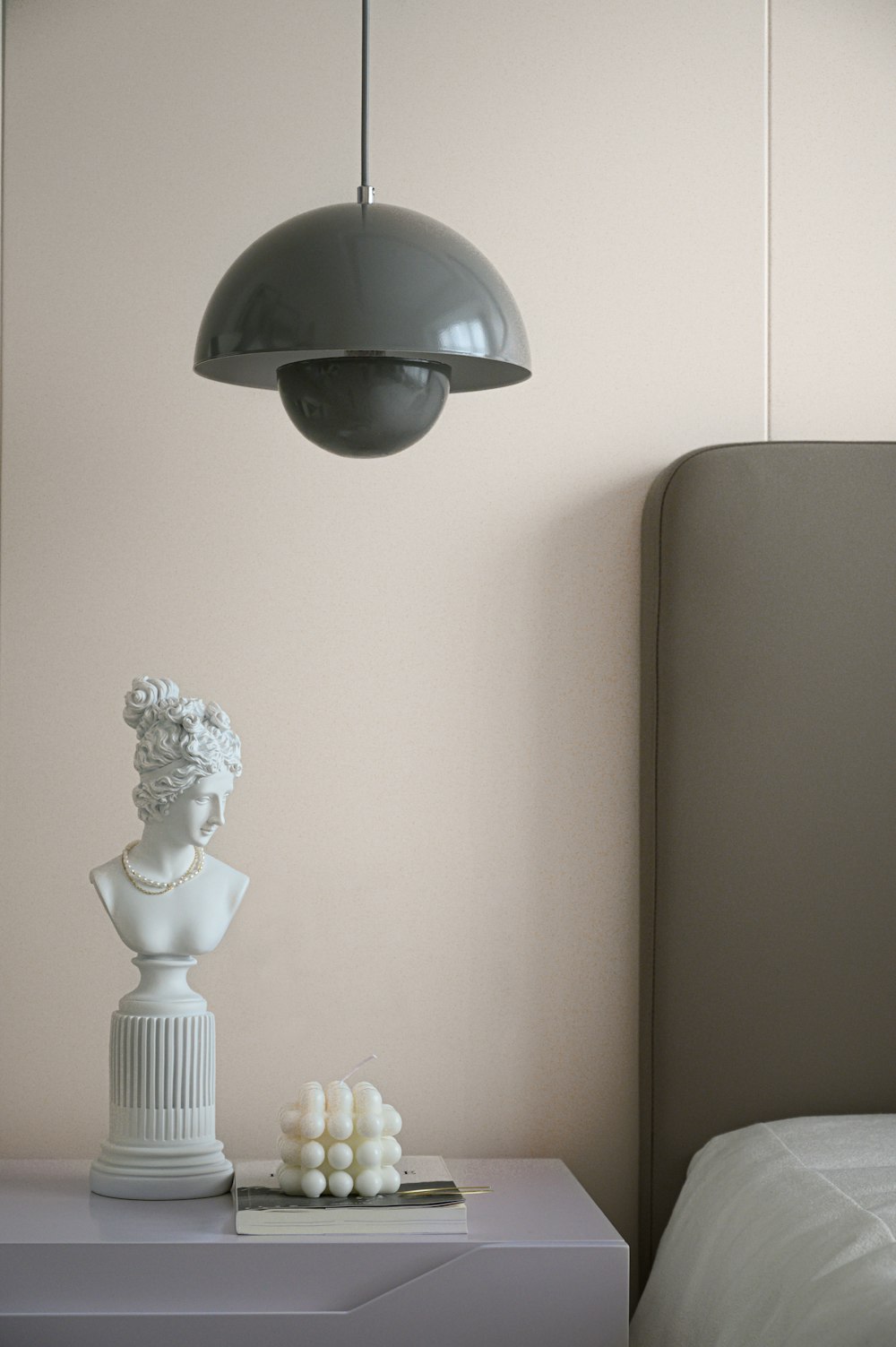 white ceramic angel figurine on white table