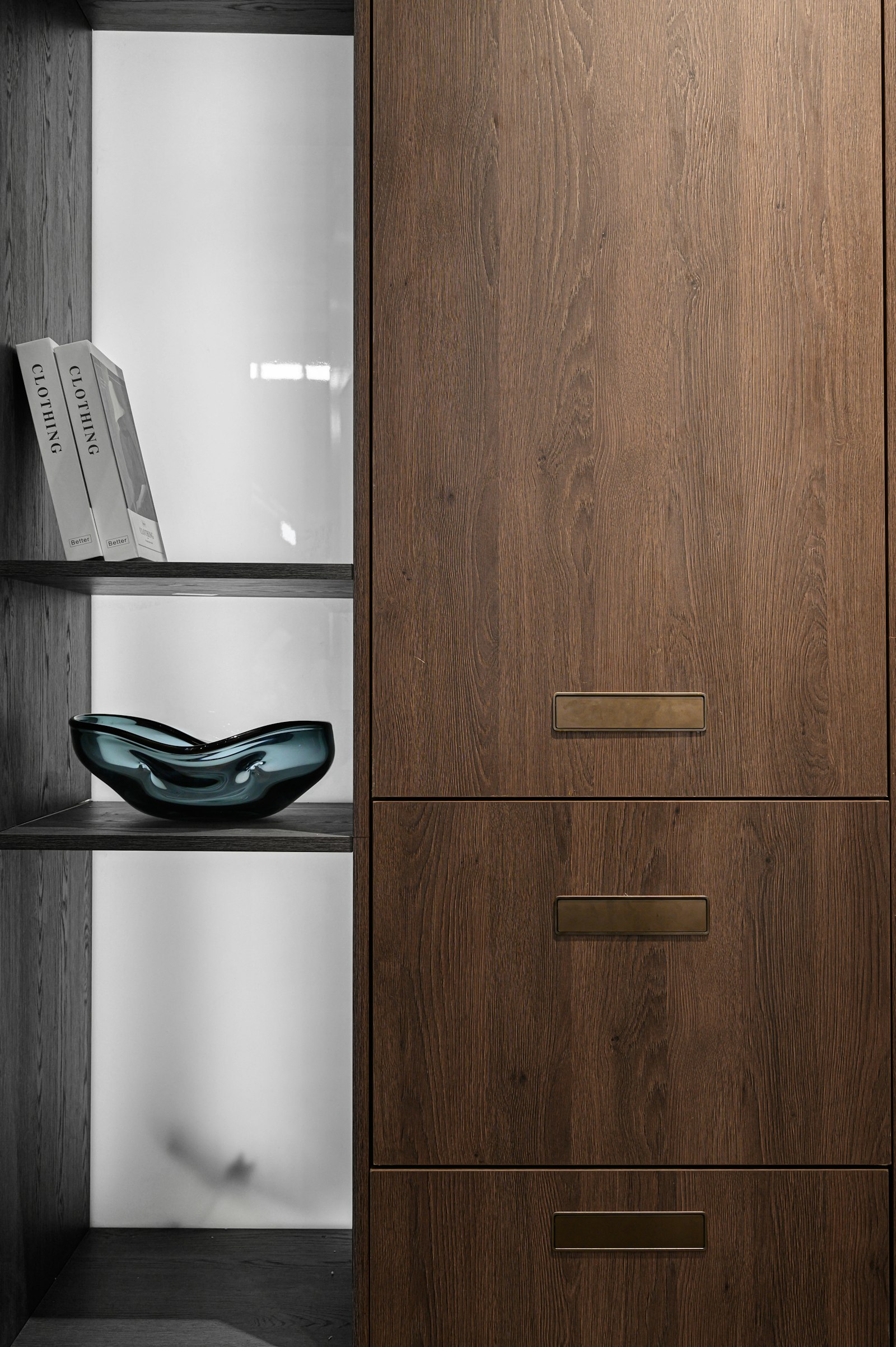 Woodworker measuring with pro-grade tools to build custom built-ins in Coral Gables