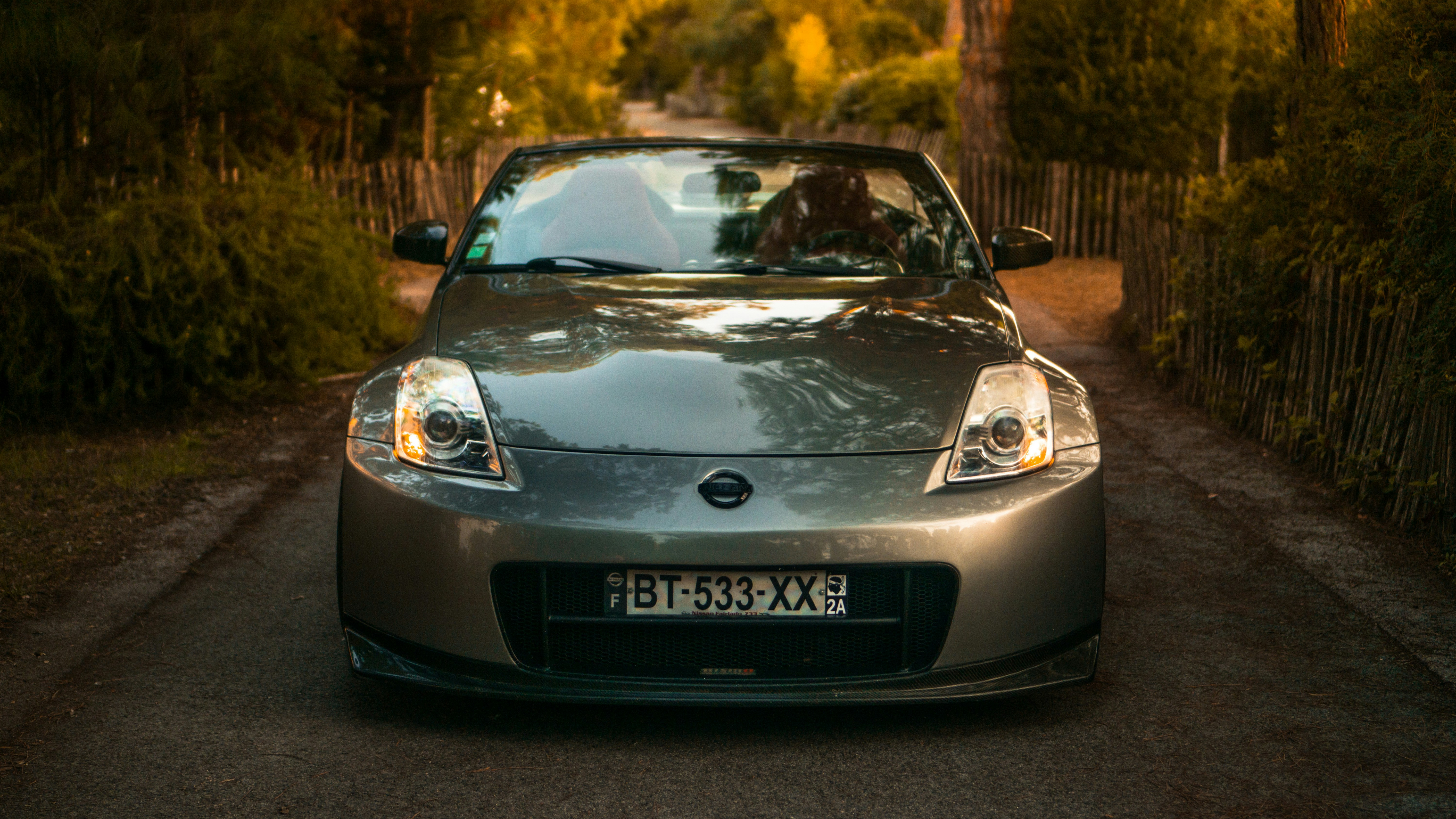 grey porsche 911 parked on grey pavement