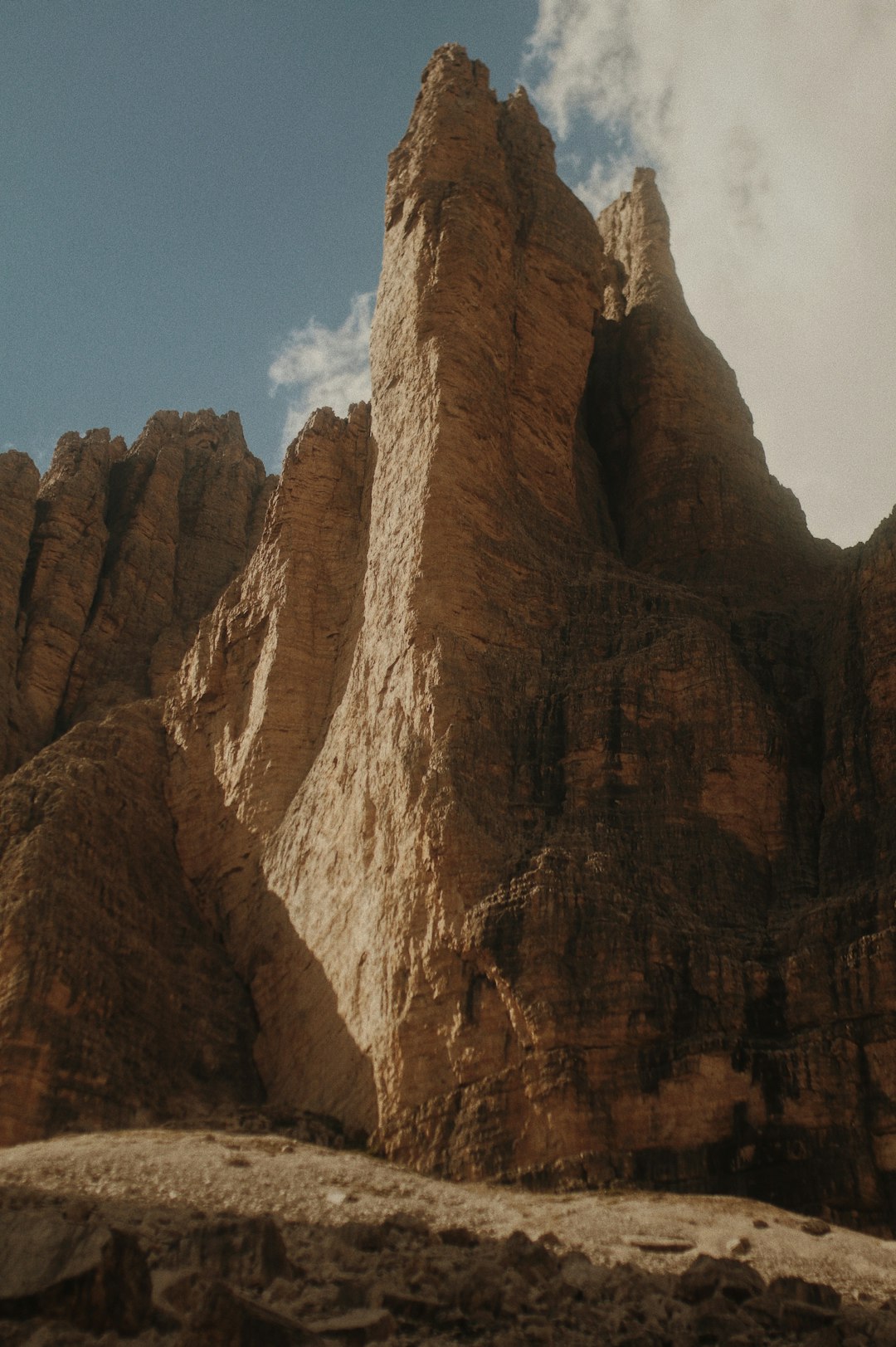 brown rocky mountain under blue sky during daytime