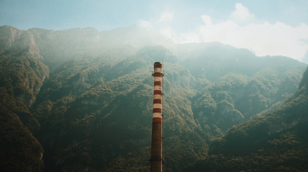 brown and white tower on mountain