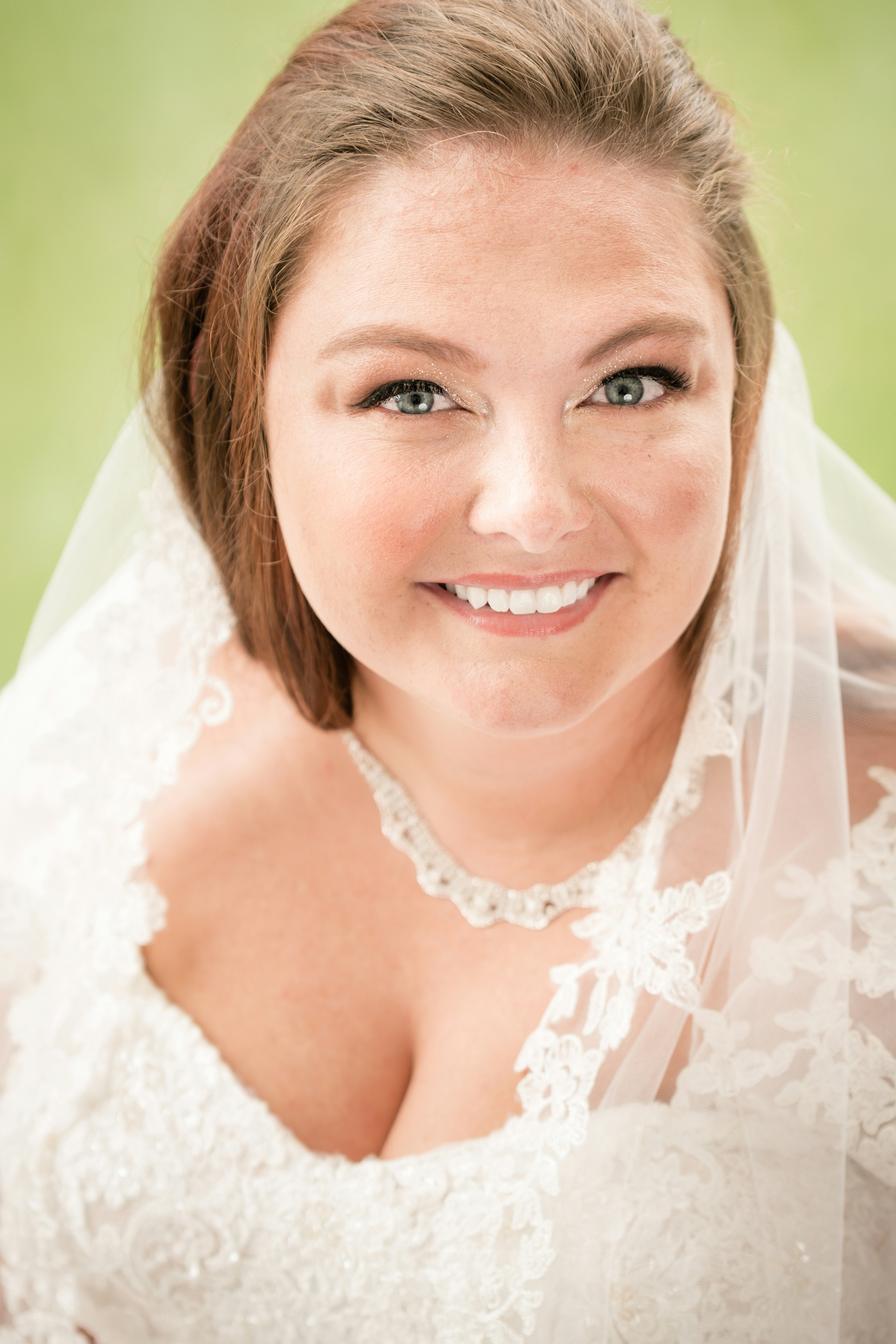 woman in white floral lace wedding dress