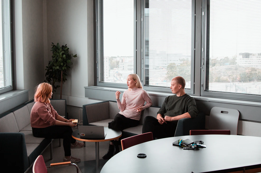 Personal-injury firm team reviewing case files together in a bright modern conference room