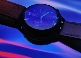 Vibrant turquoise watch face paired with a matching strap, glowing under natural sunlight.