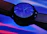Close-up of a vibrant Swatch Pop watch on a wrist, highlighting its bold colors and sleek design.
