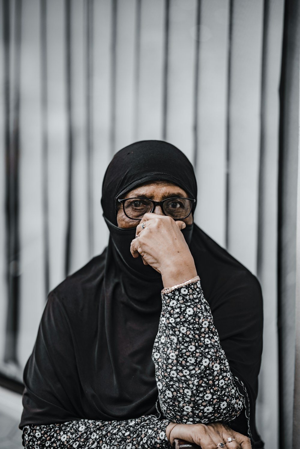 man in black knit cap covering his face