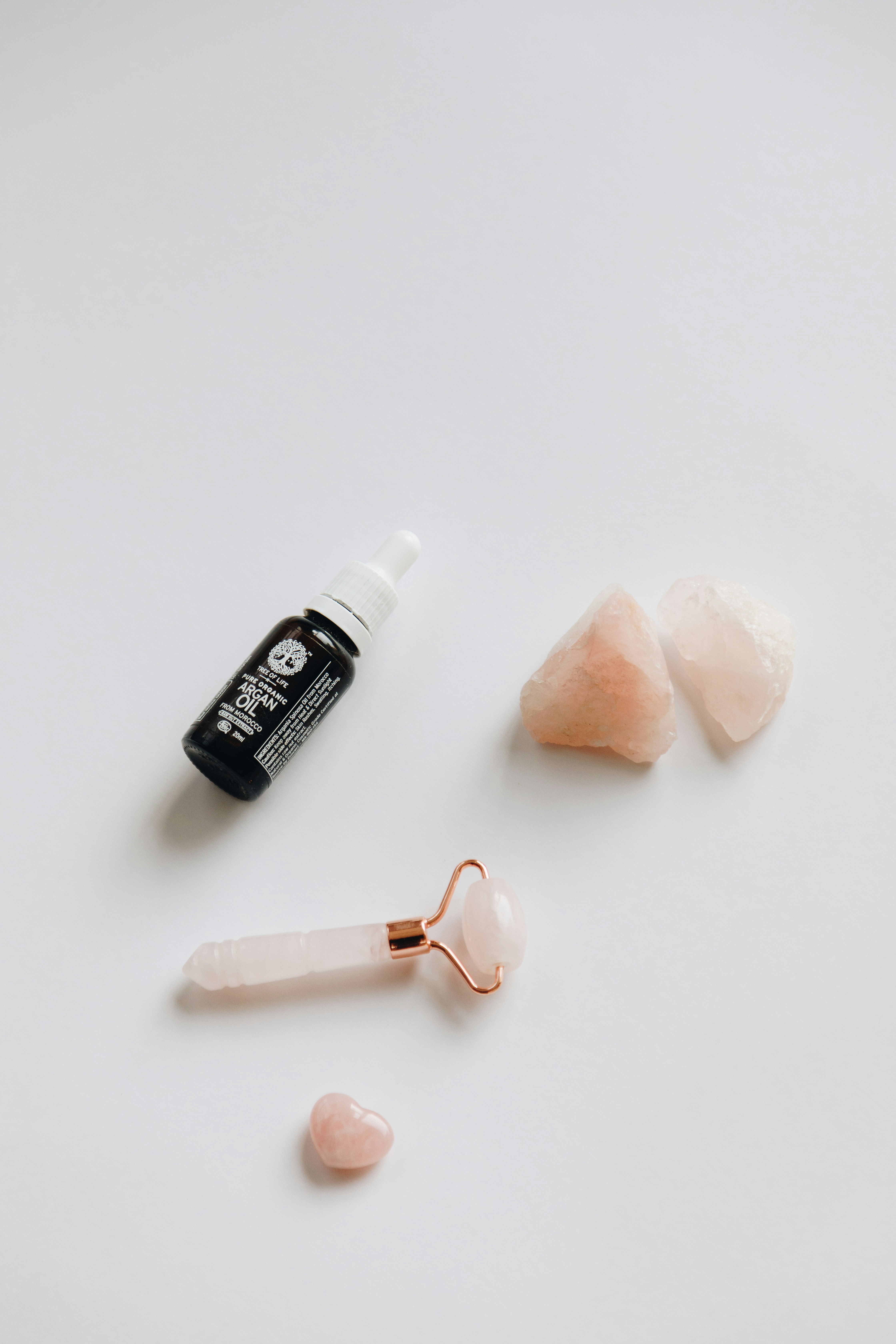 Rose quartz face roller and guasha set with Argan oil