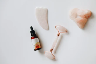 white and black plastic bottle beside white heart shaped ornament