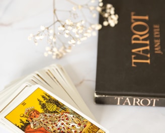 black and gold book on white table