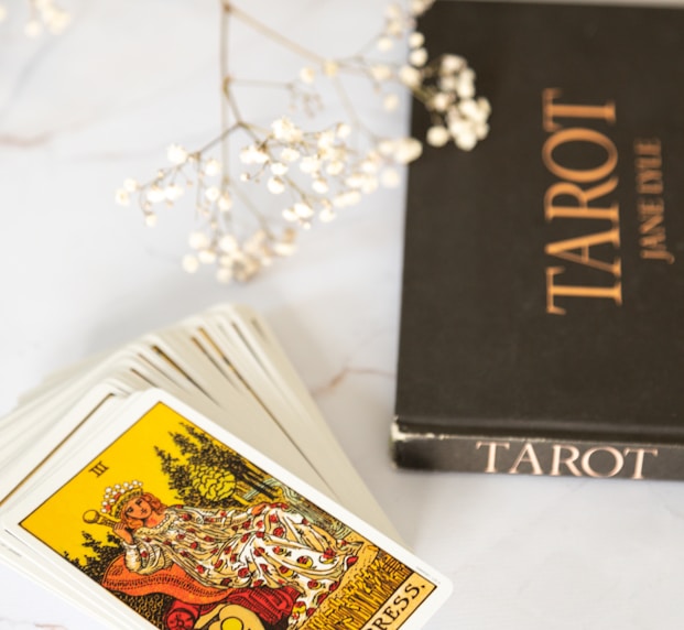 black and gold book on white table