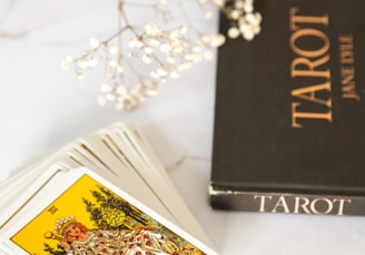 black and gold book on white table