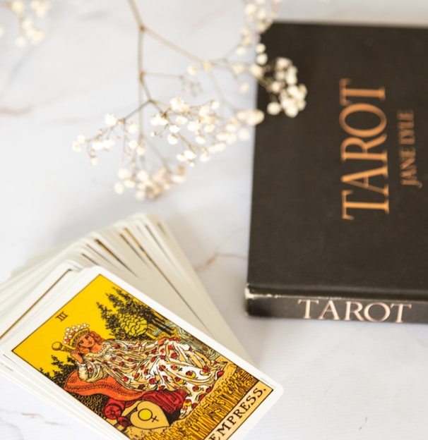 black and gold book on white table