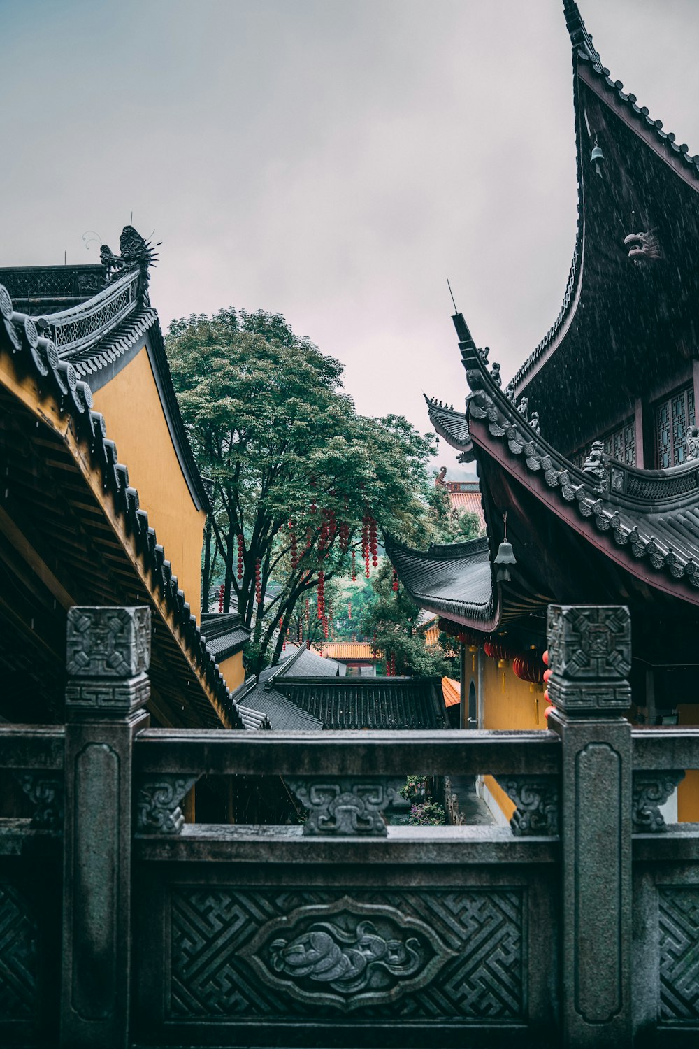 brown and black temple near green trees during daytime