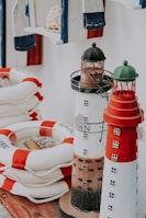 Close-up of handcrafted nautical decorations featuring ropes, shells, and miniature sails.
