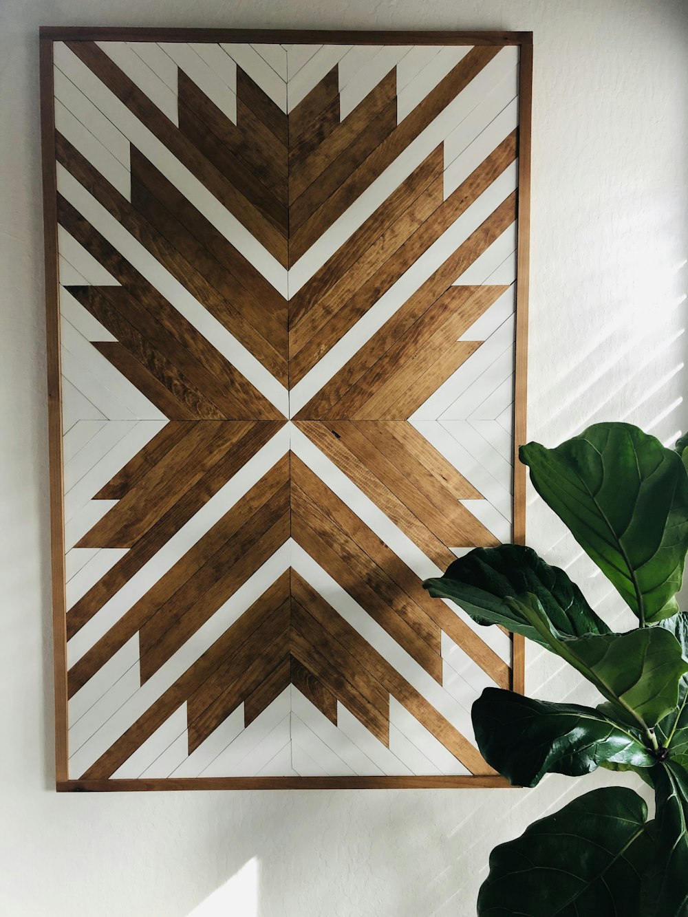 green plant on brown wooden floor