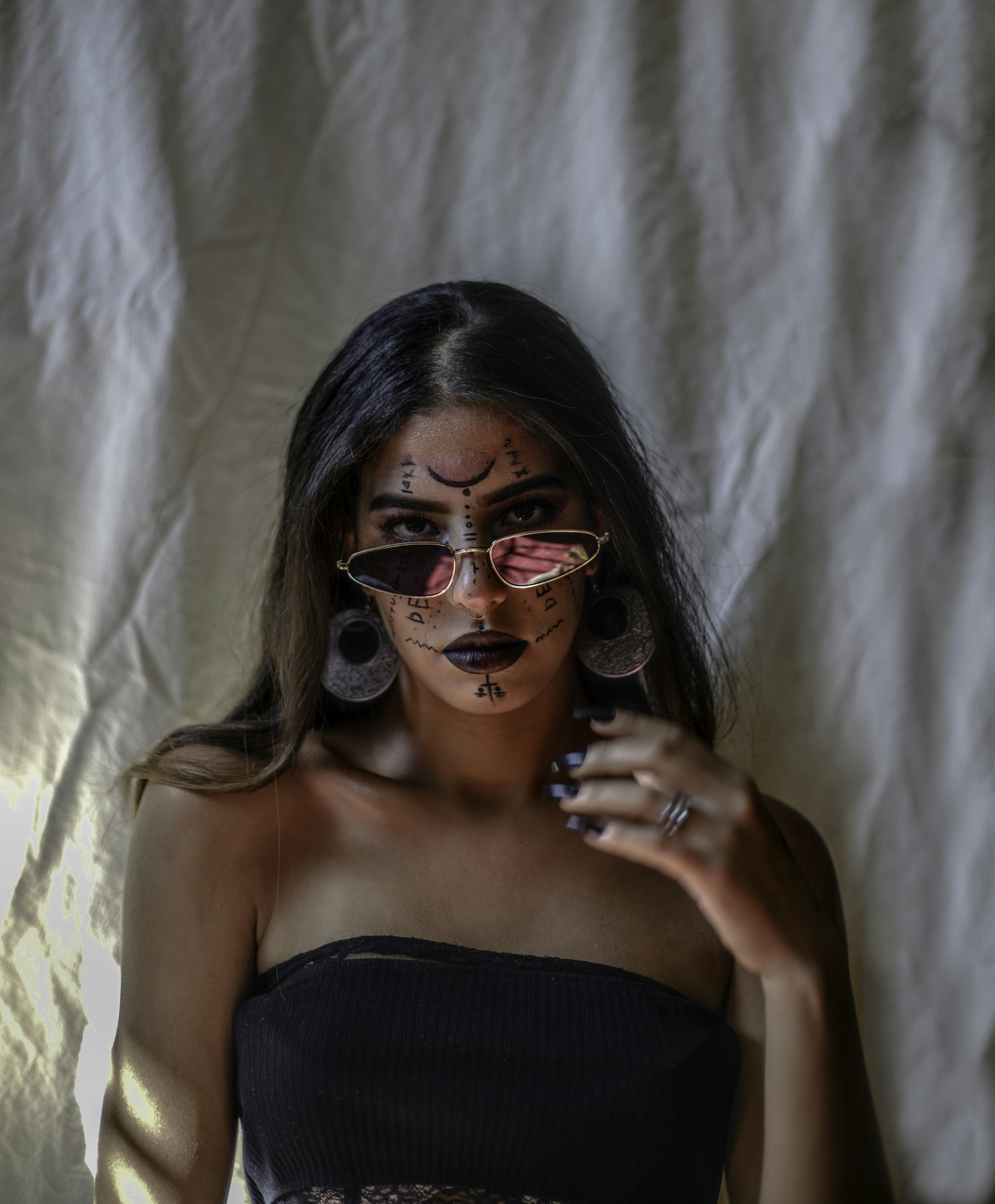 woman in black tube top wearing sunglasses