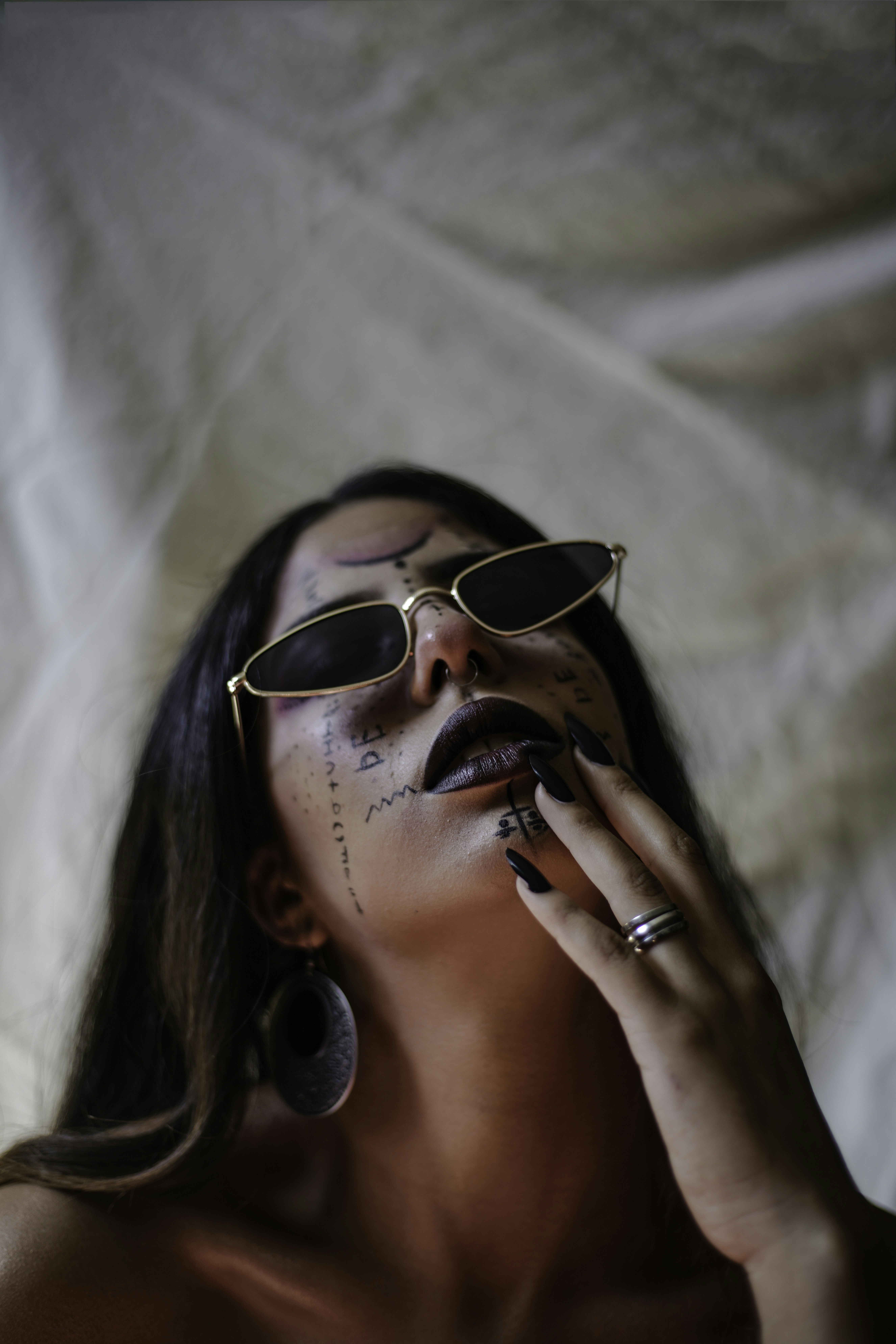 woman wearing gold framed aviator sunglasses