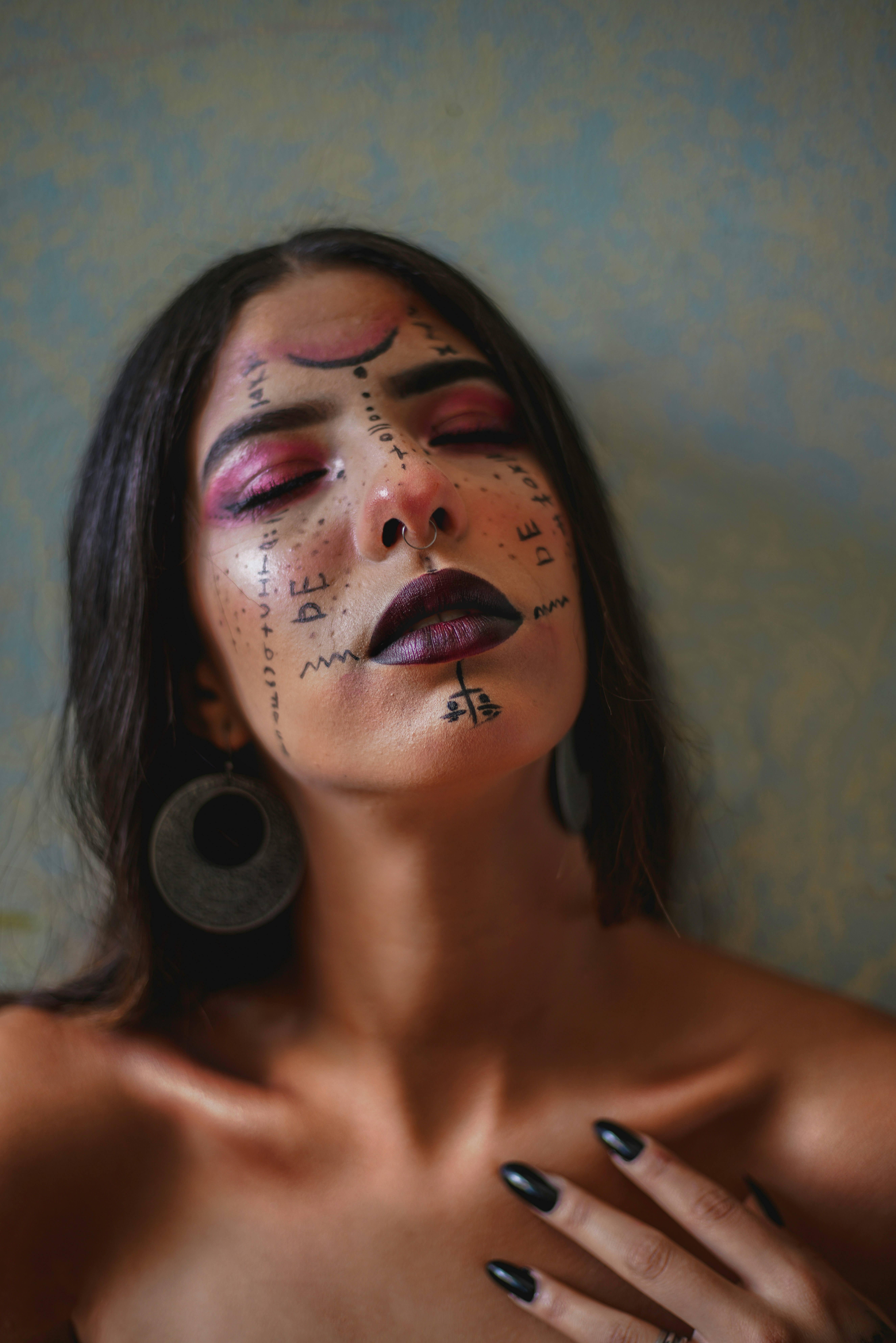 woman with black and white eye shadow
