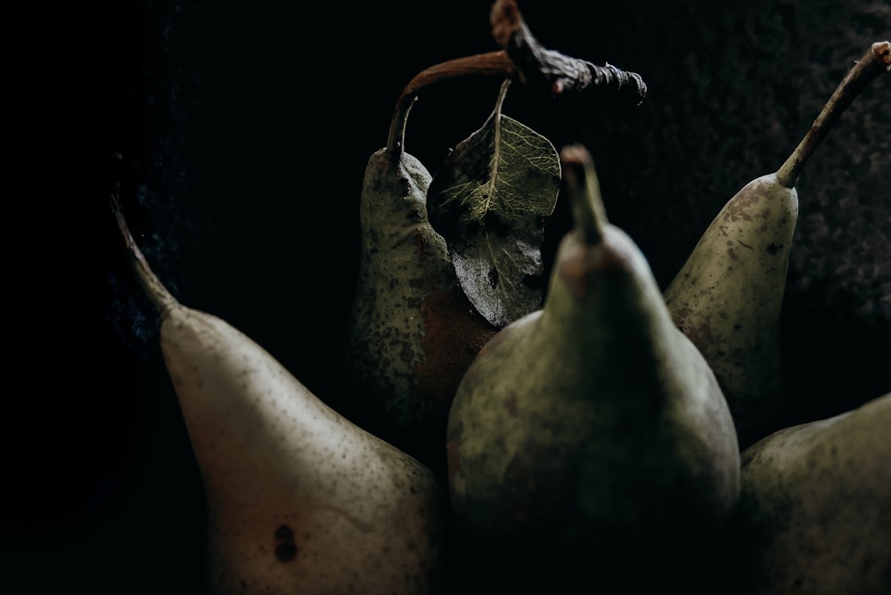 3 brown and green fruit