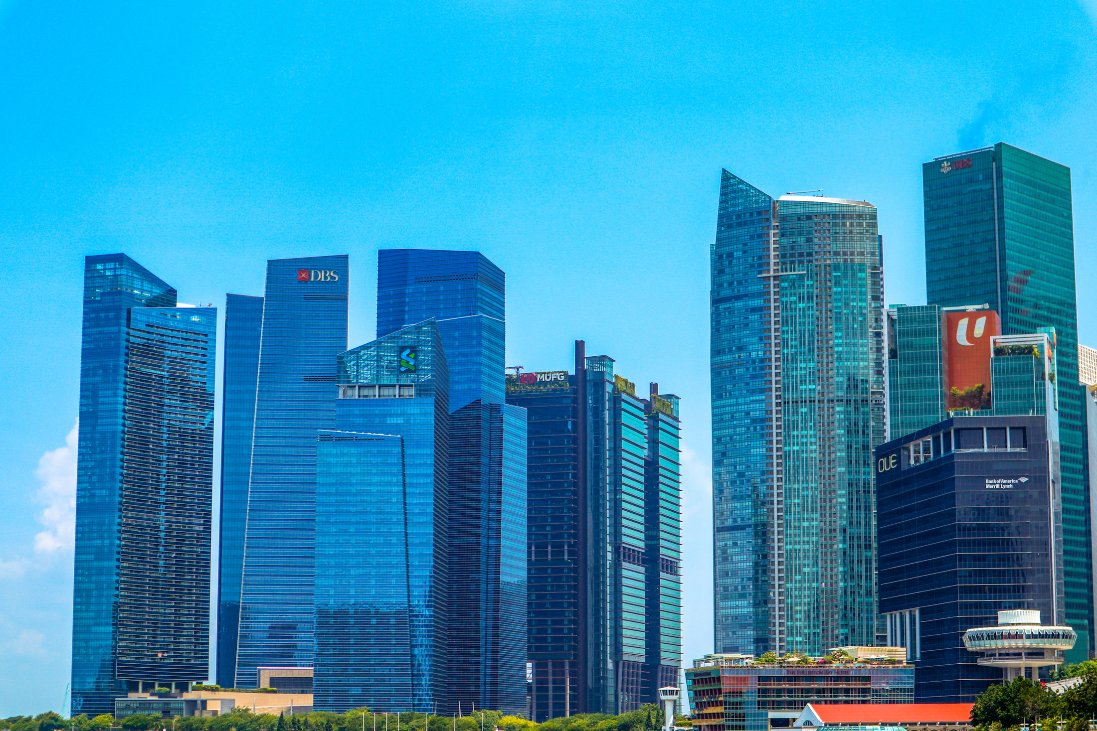 Singapore city buildings under a clear blue sky