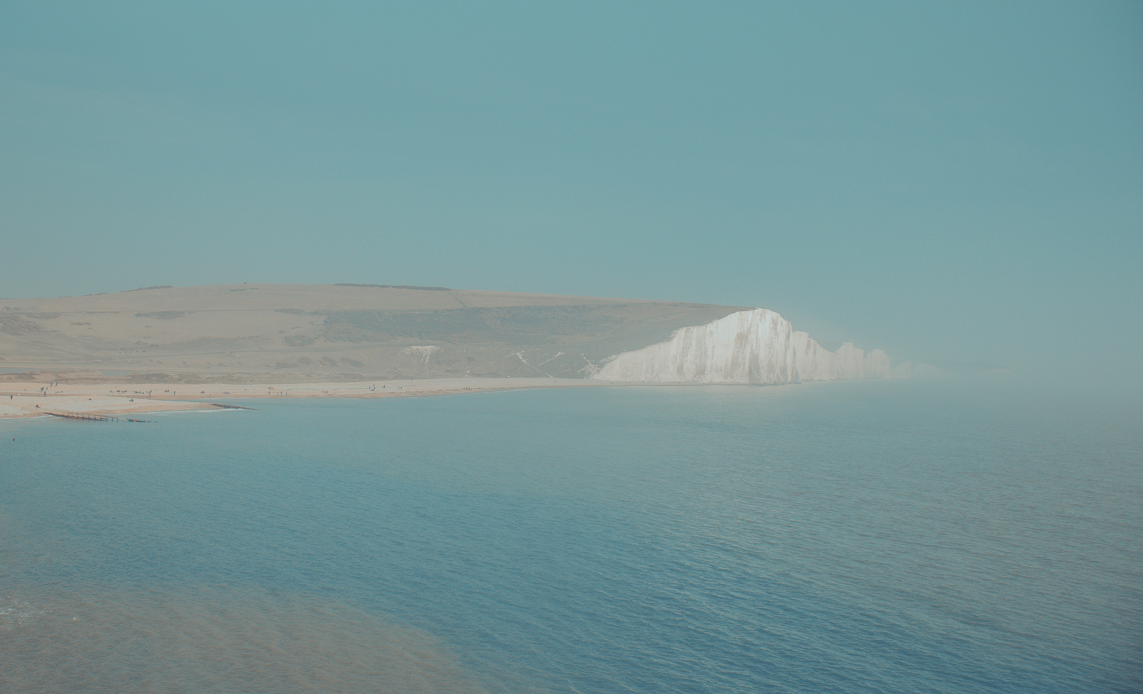 White mountain near body of water during daytime photo – Free Beach ...