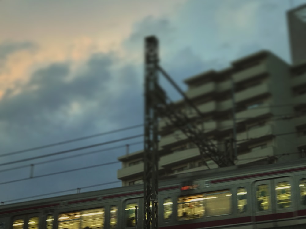 white and black train under cloudy sky during daytime