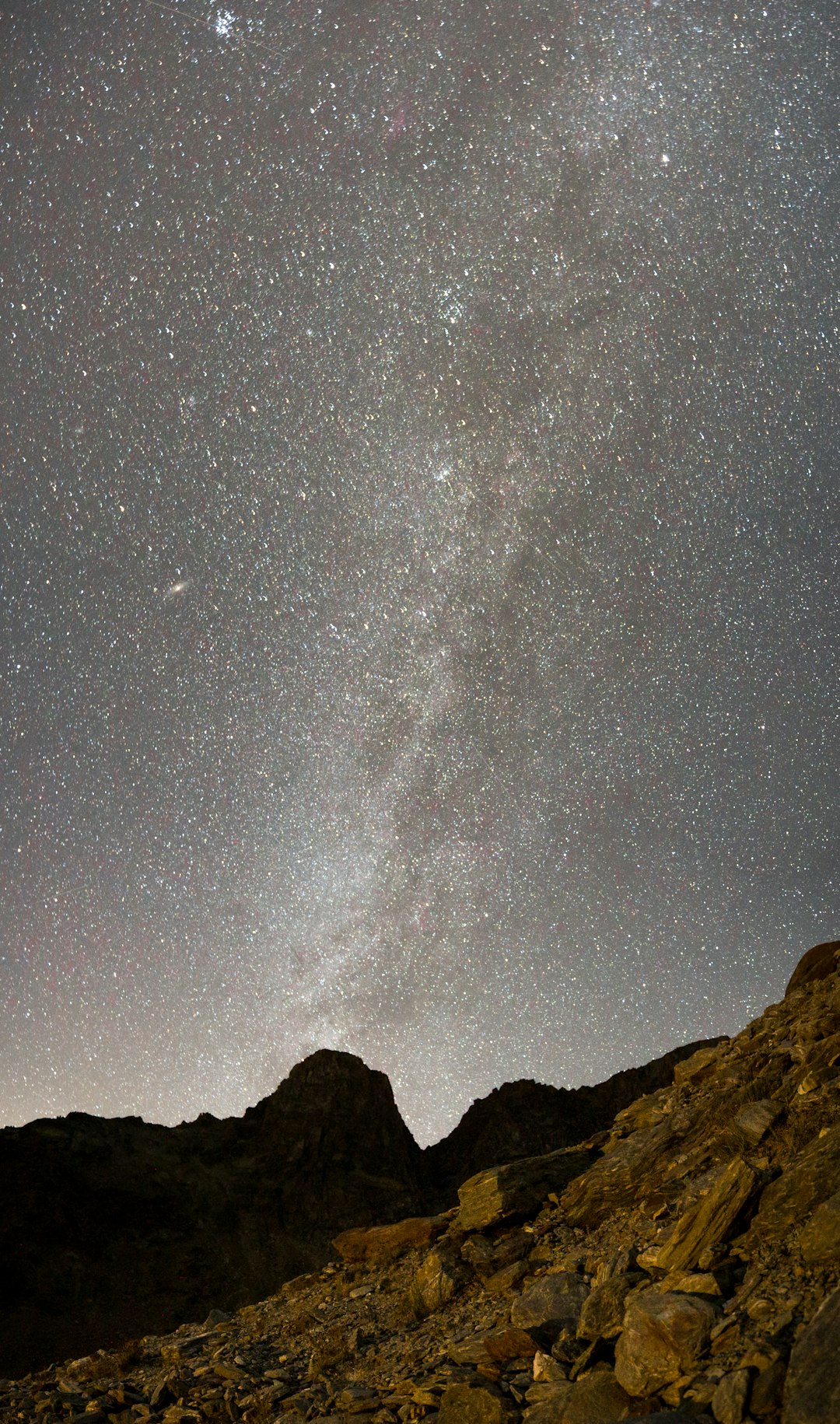 black and white mountain under starry night