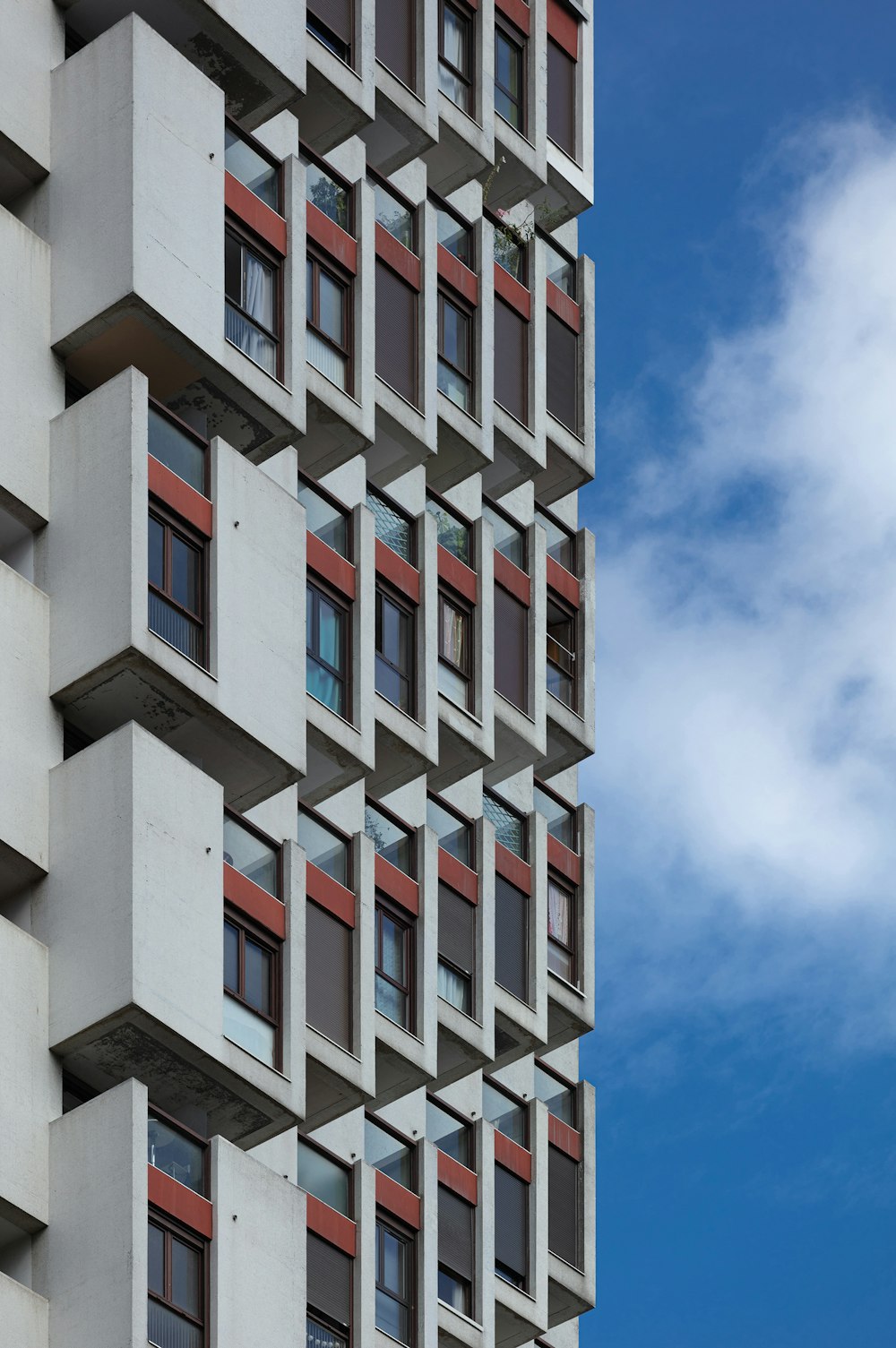 white and blue concrete building under blue sky during daytime