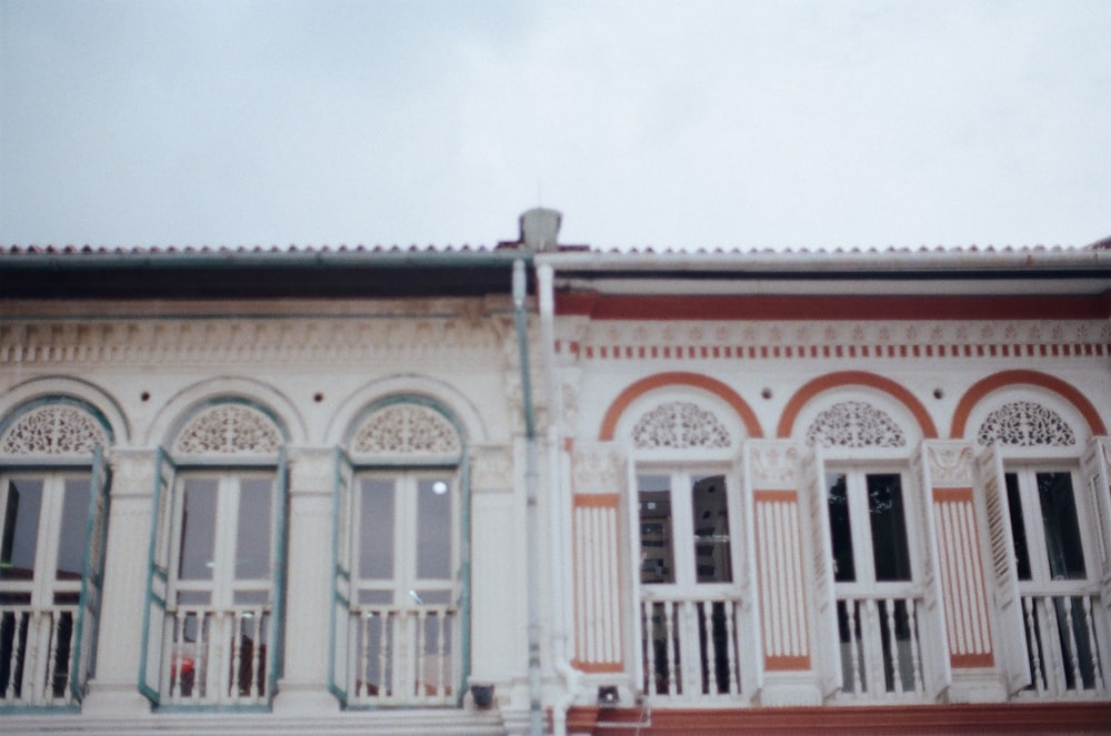 white and brown concrete building under white sky during daytime