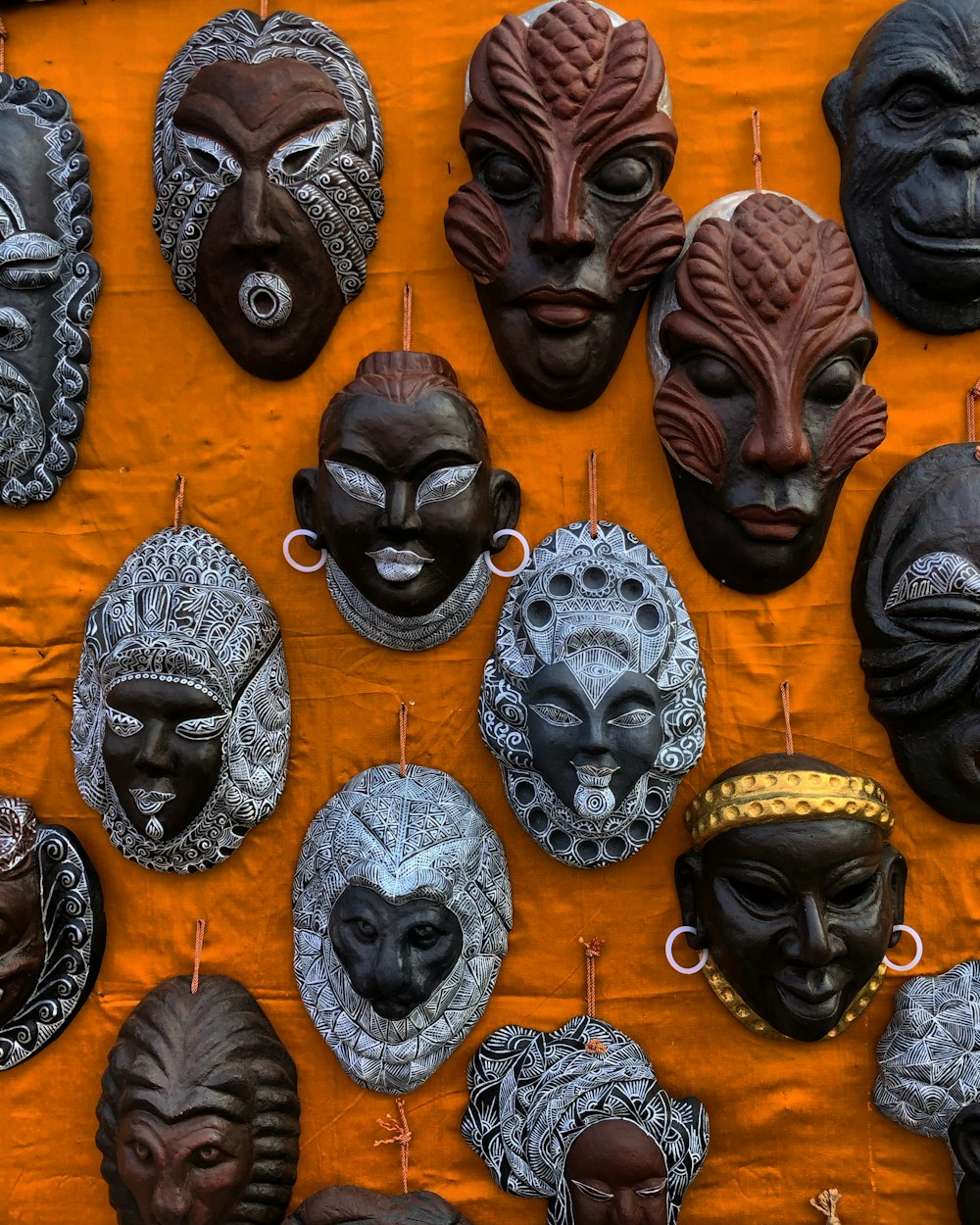 brown and black mask on brown wooden table