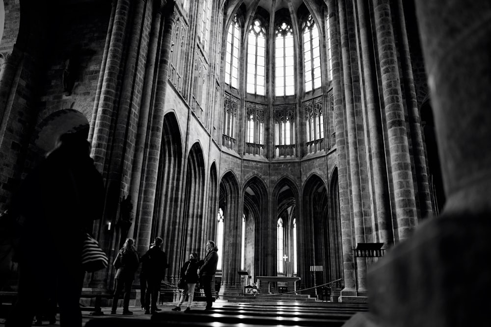 people walking inside a cathedral
