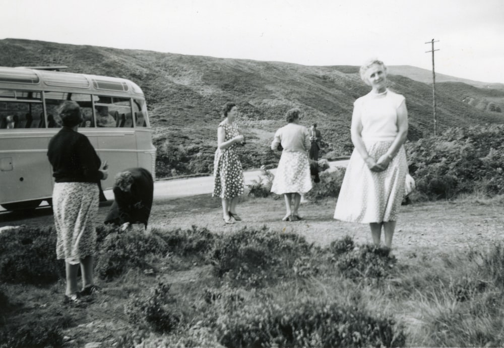 woman in white dress standing beside woman in white dress