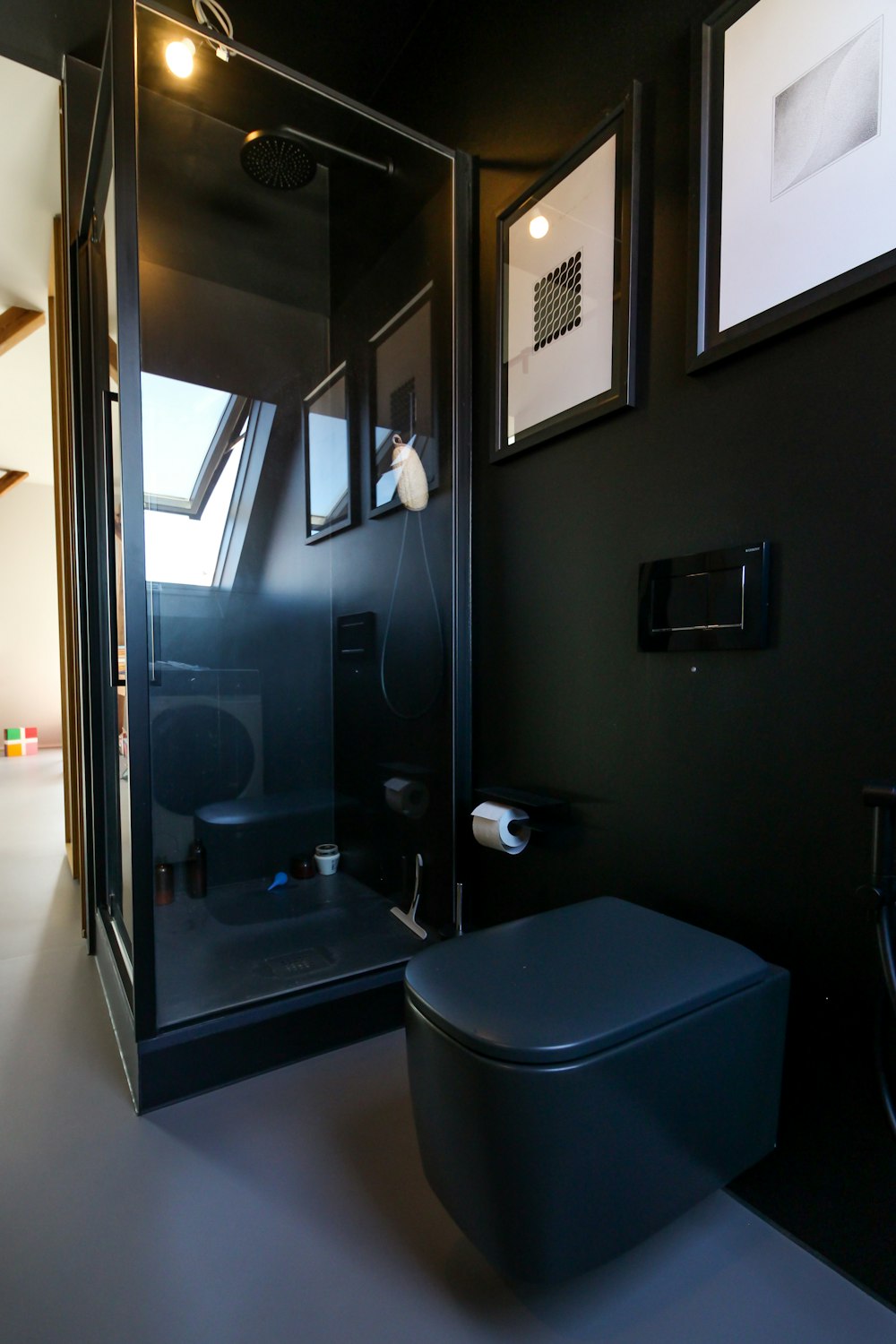 blue plastic container beside black wooden door