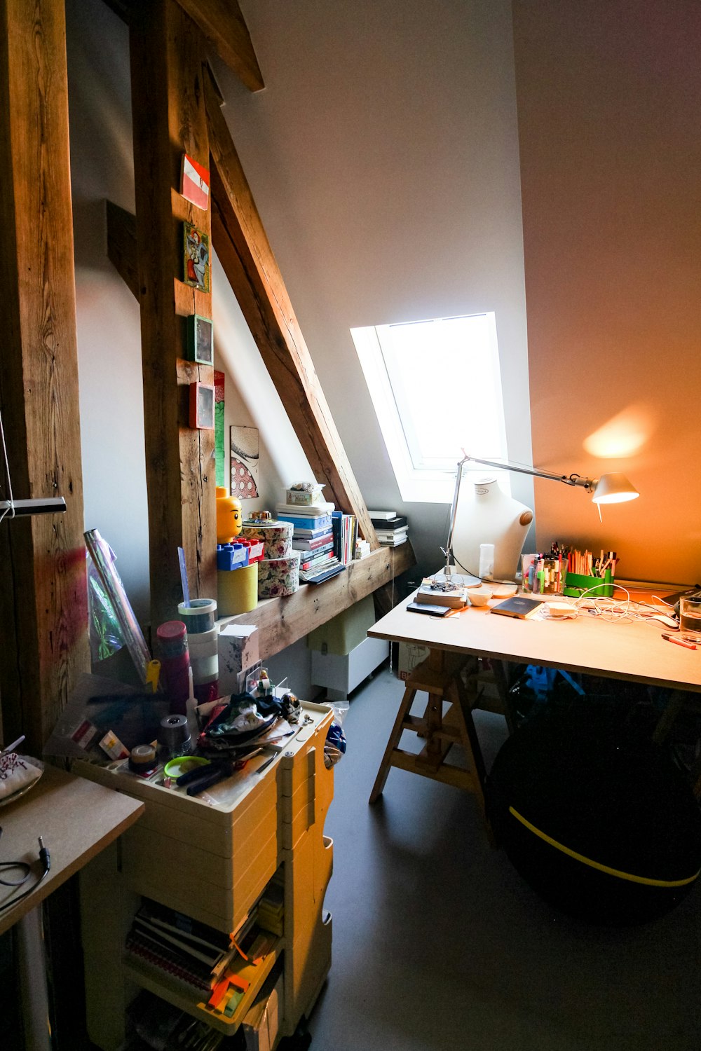 brown wooden desk with assorted items