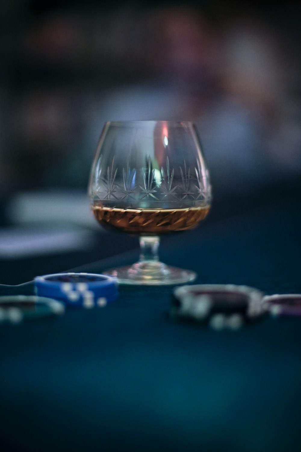 clear wine glass on blue table