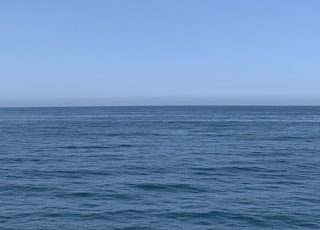 blue ocean under blue sky during daytime