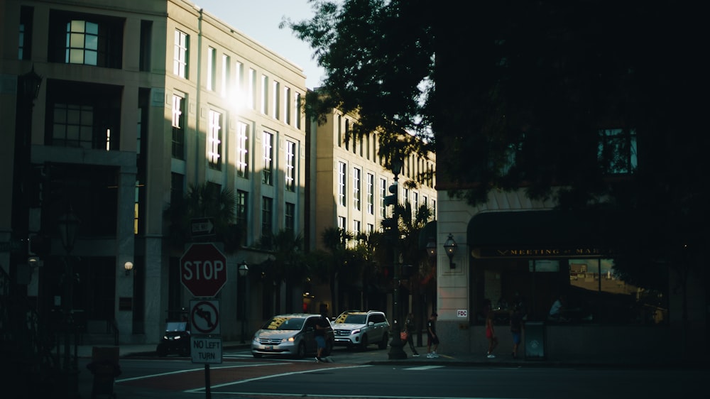 cars parked in front of white building