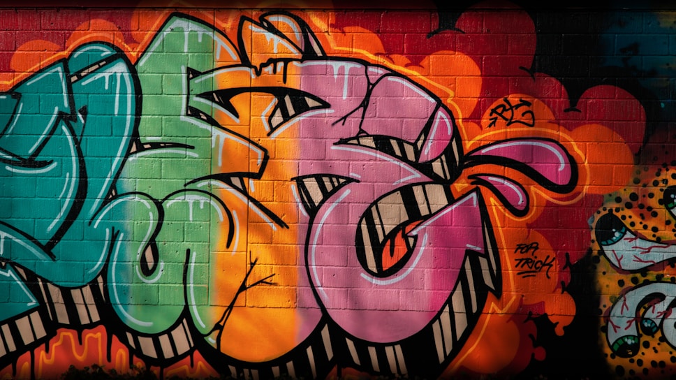 A vibrant graffiti-covered brick wall illuminated by neon lights, capturing the raw energy of 80s hip hop culture.